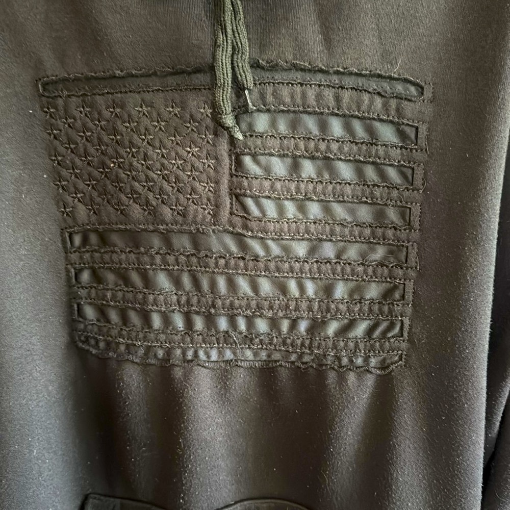 Black Hoodie with Embroidered American Flag Design.